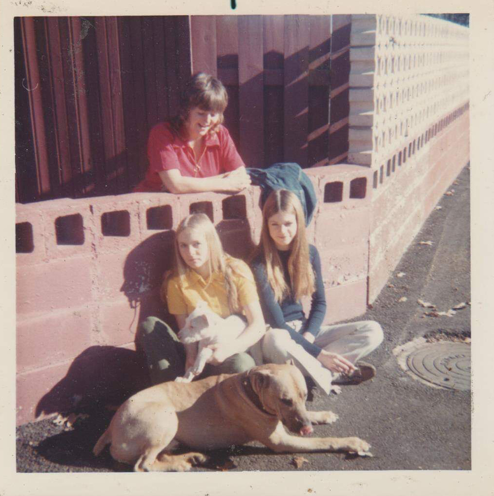 Pat Hosie in the back, Joan Phipps holding the dog, Karen on the right.