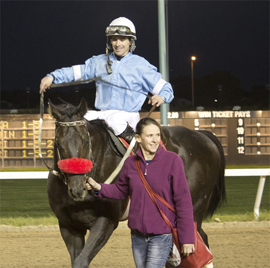 Zdeno walks into Winner's Circle with Heather Gulewich, after winning 2014 Sifton Stakes at Assiniboia Downs.